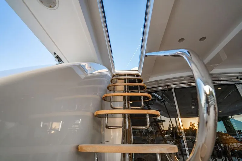 True North Yacht Photos Pics Staircase on 2011 Hargrave Tri Deck yacht, leading to upper deck with clear sky view.