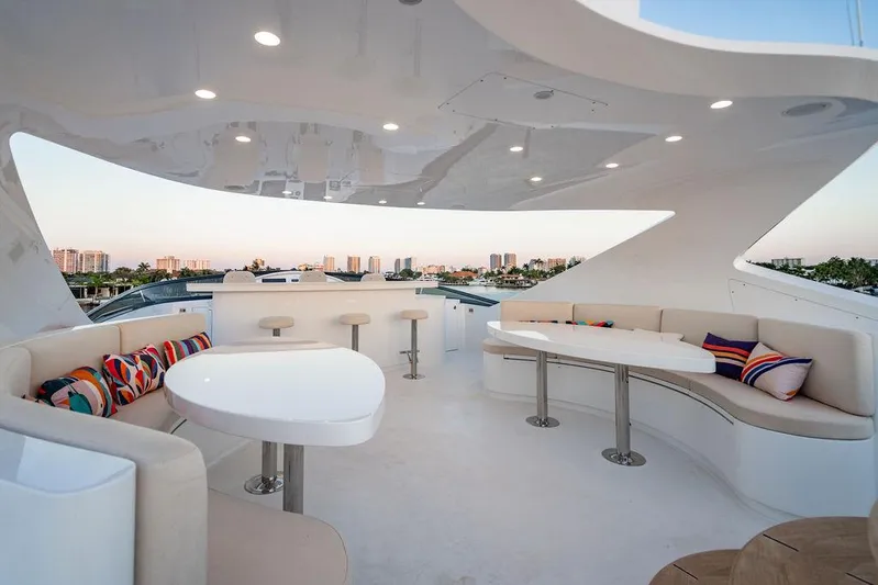 True North Yacht Photos Pics Luxurious 2011 Hargrave Tri Deck yacht interior with modern seating and vibrant cushions.