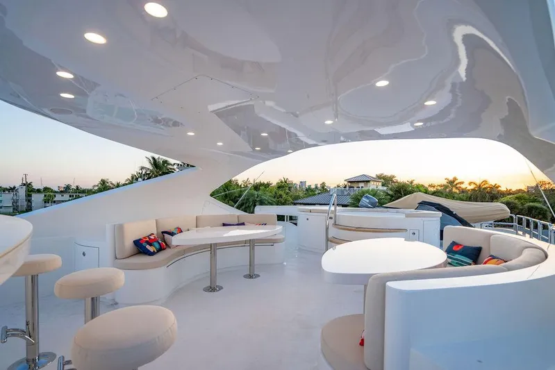 True North Yacht Photos Pics Luxurious 2011 Hargrave Tri Deck yacht with elegant outdoor seating and sunset view.