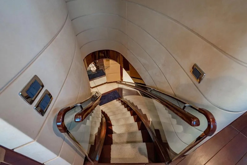 True North Yacht Photos Pics Elegant staircase inside 2011 Hargrave Tri Deck yacht with polished wood handrails.