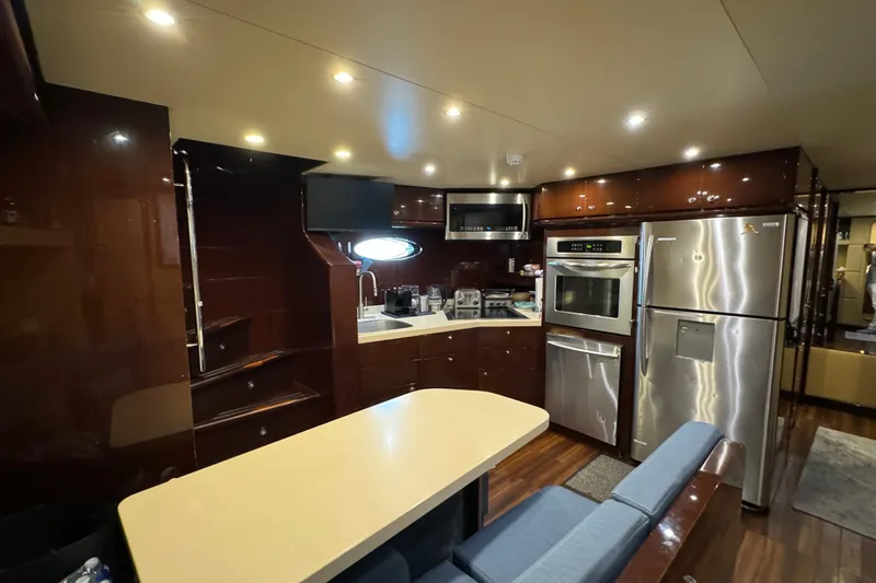 True North Yacht Photos Pics Luxurious kitchen interior of 2011 Hargrave Tri Deck yacht with modern appliances.