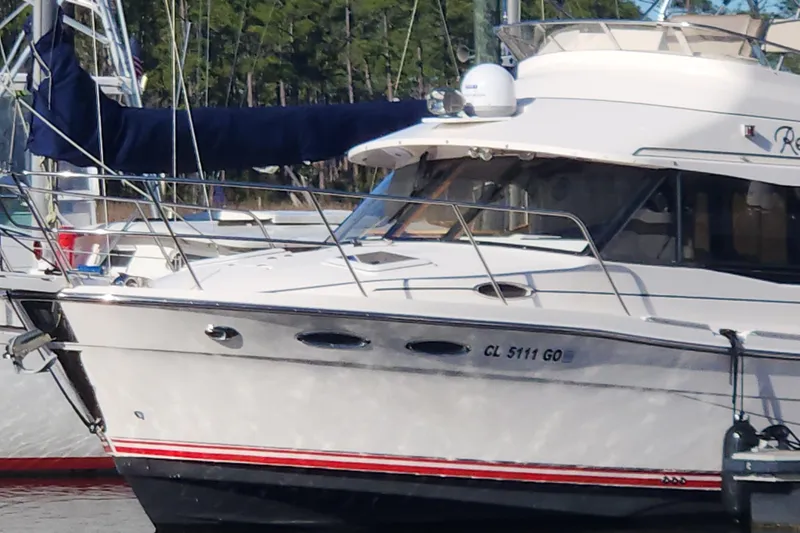  Yacht Photos Pics 2021 Cutwater C-32 CB boat docked, featuring sleek design and modern amenities.