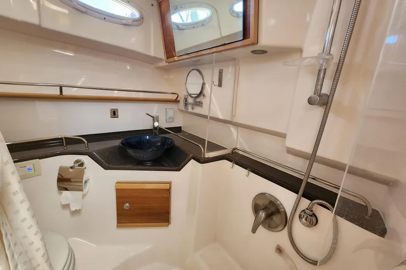  Yacht Photos Pics 2021 Cutwater C-32 CB yacht bathroom with modern fixtures and elegant design.