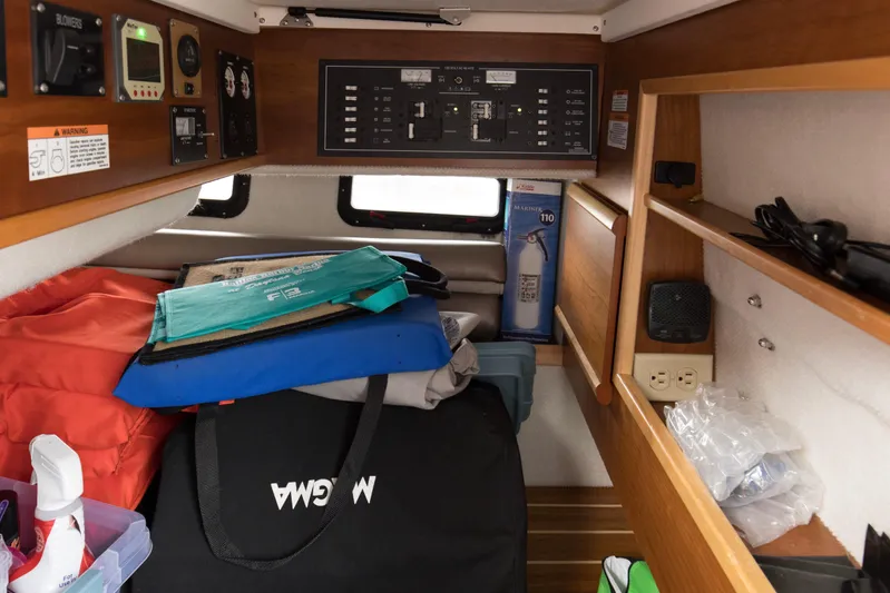  Yacht Photos Pics 2021 Cutwater C-32 CB cabin interior with storage, control panel, and safety equipment.