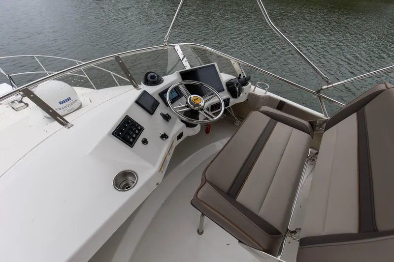  Yacht Photos Pics 2021 Cutwater C-32 CB helm with dual seats and navigation controls.