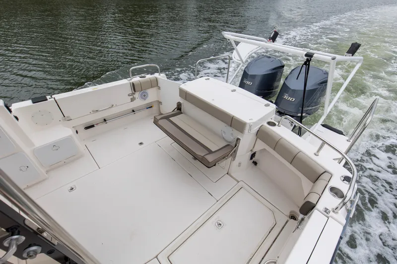  Yacht Photos Pics 2021 Cutwater C-32 CB boat deck with dual engines, spacious seating, and water view.