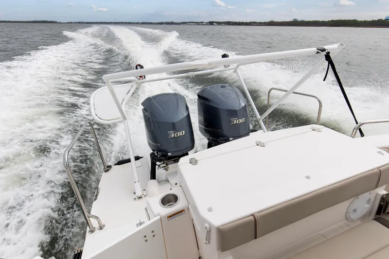  Yacht Photos Pics 2021 Cutwater C-32 CB boat with dual 300 horsepower engines cruising on open water.