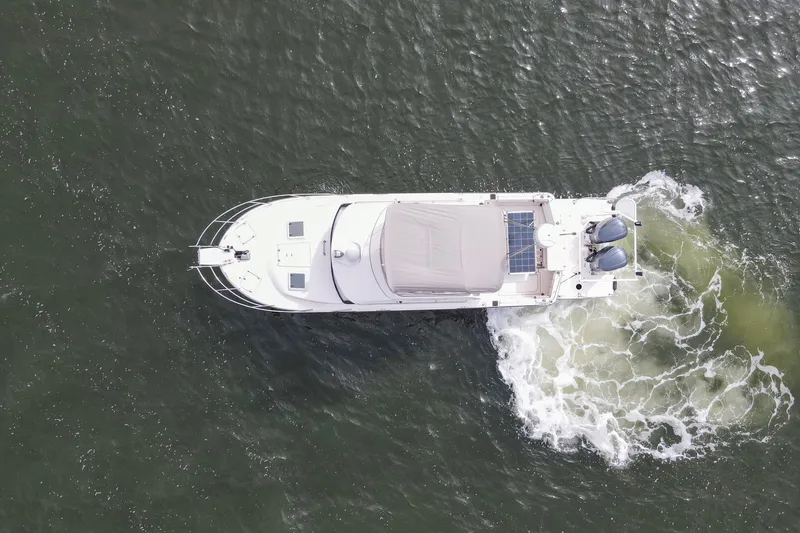  Yacht Photos Pics Aerial view of 2021 Cutwater C-32 CB boat cruising on water.