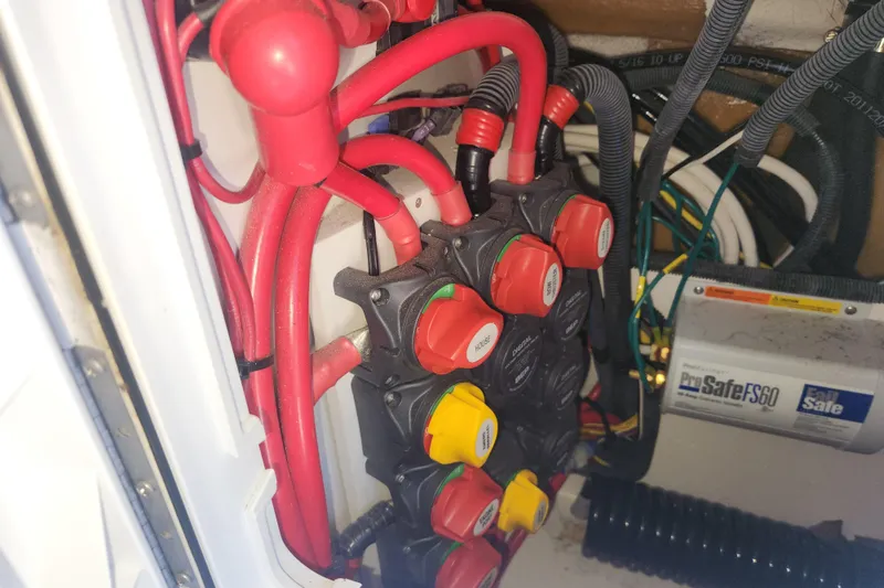  Yacht Photos Pics Electrical system of a 2021 Cutwater C-32 CB boat with red cables and switches.