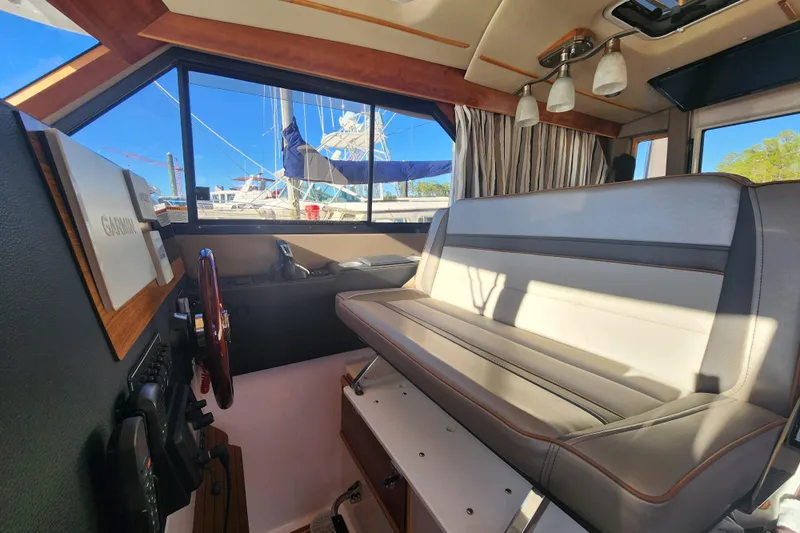  Yacht Photos Pics Interior of 2021 Cutwater C-32 CB boat with seating and navigation equipment.