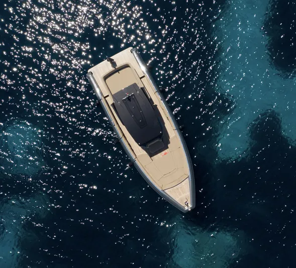 Black Shiver 100 Yacht Photos Pics Aerial view of 2025 Novamarine Black Shiver 100 Diesel on sparkling blue water.