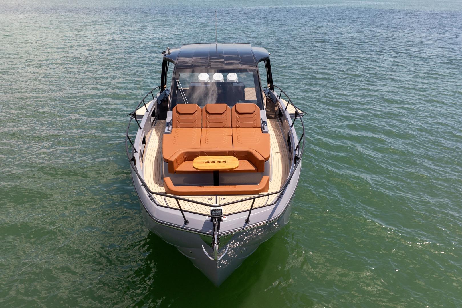 Luxury Hanover 447 yacht, 2026 model, with sunbathing deck on calm waters.