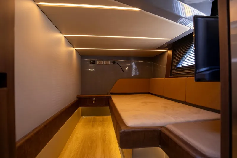  Yacht Photos Pics Luxurious interior of 2026 Hanover 447 with modern lighting and comfortable seating.