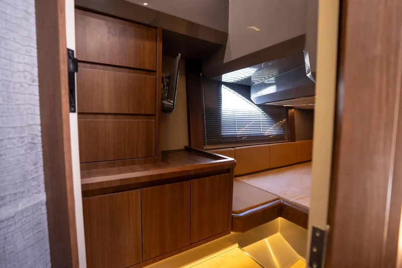  Yacht Photos Pics Luxurious interior of 2026 Hanover 447 yacht with sleek wooden cabinetry and modern design.