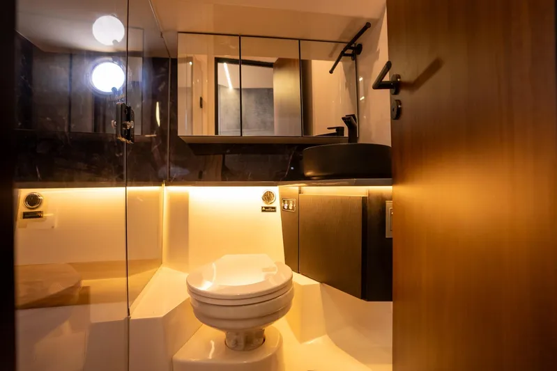  Yacht Photos Pics Luxurious bathroom interior in 2026 Hanover 447 model, featuring modern fixtures and ambient lighting.