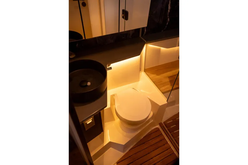  Yacht Photos Pics Luxurious bathroom in 2026 Hanover 447 model yacht with modern lighting and sleek design.