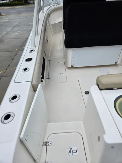 Yacht Photos Pics 2015 Pursuit S280 boat interior with storage compartments and seating.