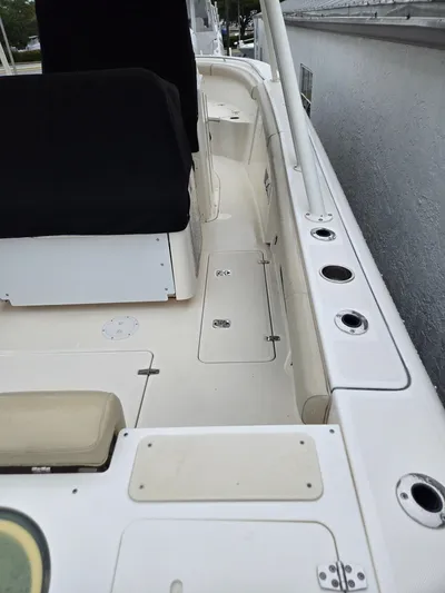  Yacht Photos Pics 2015 Pursuit S280 boat deck with seating and storage compartments.