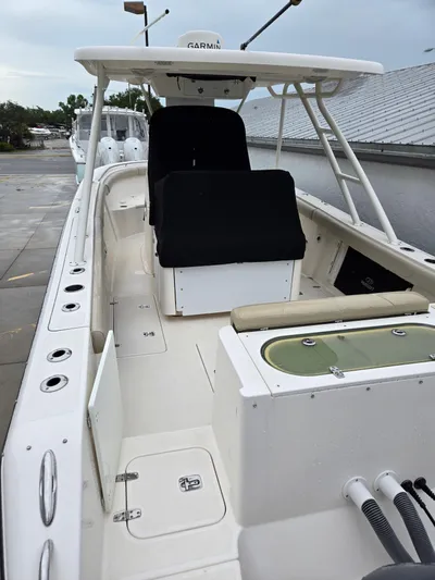  Yacht Photos Pics 2015 Pursuit S280 boat interior with seating and storage compartments.