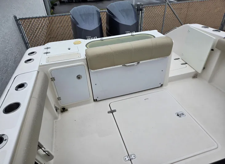  Yacht Photos Pics 2015 Pursuit S280 boat interior with storage compartments and seating.