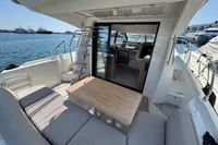 2020 Prestige 420 yacht with outdoor seating and table, docked at marina.