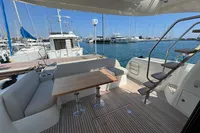 Prestige 420 yacht deck with seating and table, docked at marina, 2020 model.