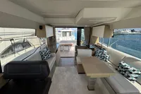 Luxurious interior of a 2020 Prestige 420 yacht with elegant seating and waterfront view.