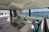 Luxurious interior of a 2020 Prestige 420 yacht with elegant seating and ocean view.