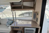 Interior of a 2020 Prestige 420 yacht with modern kitchen amenities.
