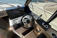 Helm of 2020 Prestige 420 yacht with modern controls and navigation system.