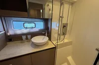 Modern bathroom in 2020 Prestige 420 yacht with sleek sink and shower.
