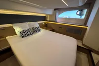 Luxurious cabin interior of 2020 Prestige 420 yacht with modern design and ambient lighting.