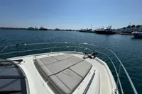 Prestige 420 yacht, 2020 model, with sunbathing area, docked in a serene marina.