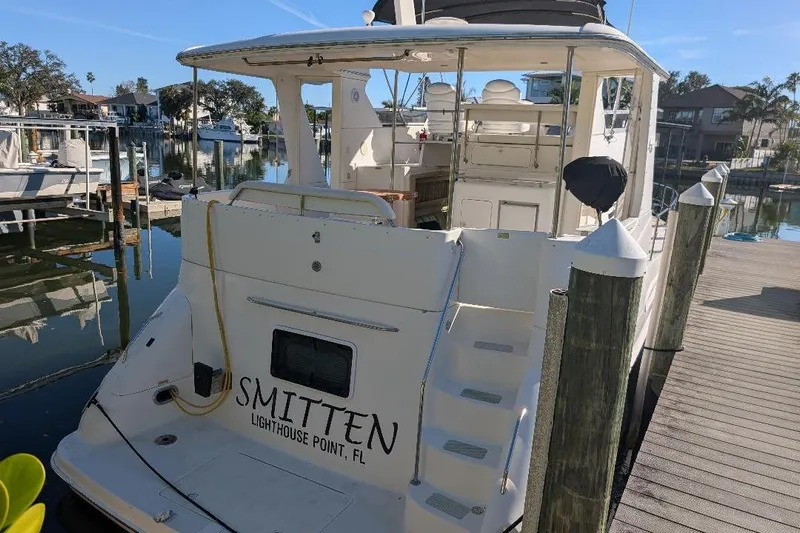 Smitten Yacht Photos Pics Sea Ray 420 Aft Cabin yacht docked at marina, Lighthouse Point, FL, 2000 model.