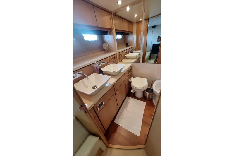  Yacht Photos Pics Luxurious bathroom in 2010 Fairline Squadron 78 yacht with dual sinks and modern fixtures.