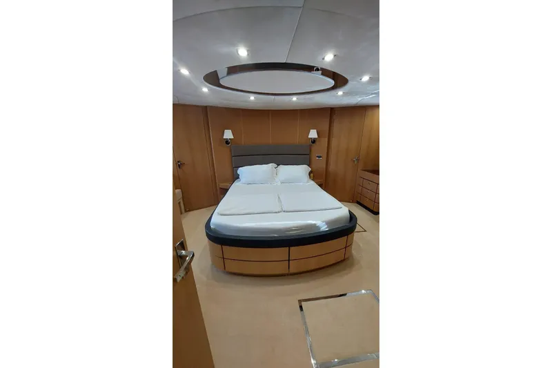  Yacht Photos Pics Luxurious bedroom interior on 2010 Fairline Squadron 78 yacht, featuring modern design and cozy ambiance.