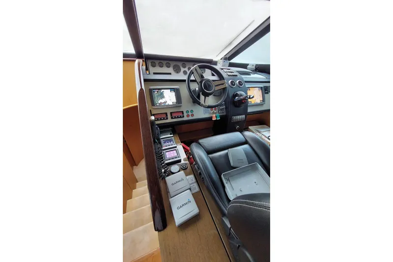  Yacht Photos Pics Cockpit of 2010 Fairline Squadron 78 yacht with navigation equipment and leather seating.
