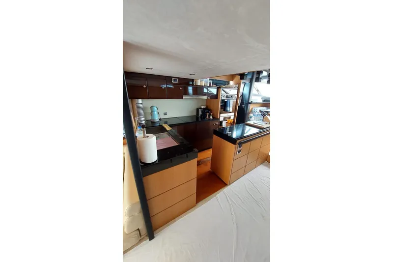  Yacht Photos Pics Luxurious kitchen interior of 2010 Fairline Squadron 78 yacht with modern amenities.