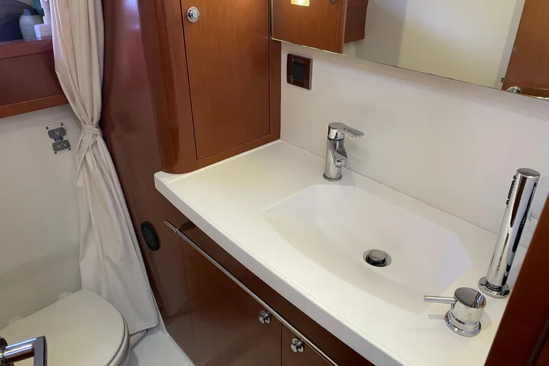 Miss Adventure Yacht Photos Pics Bathroom interior of 2013 Beneteau Swift Trawler 44 with modern sink and fixtures.
