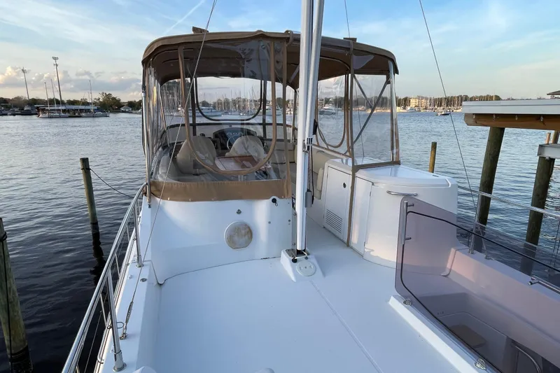 Miss Adventure Yacht Photos Pics 2013 Beneteau Swift Trawler 44 docked, featuring spacious deck and enclosed helm area.