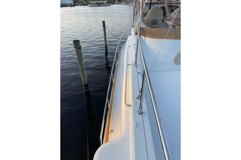 Miss Adventure Yacht Photos Pics 2013 Beneteau Swift Trawler 44 docked, showcasing sleek deck and railing design.