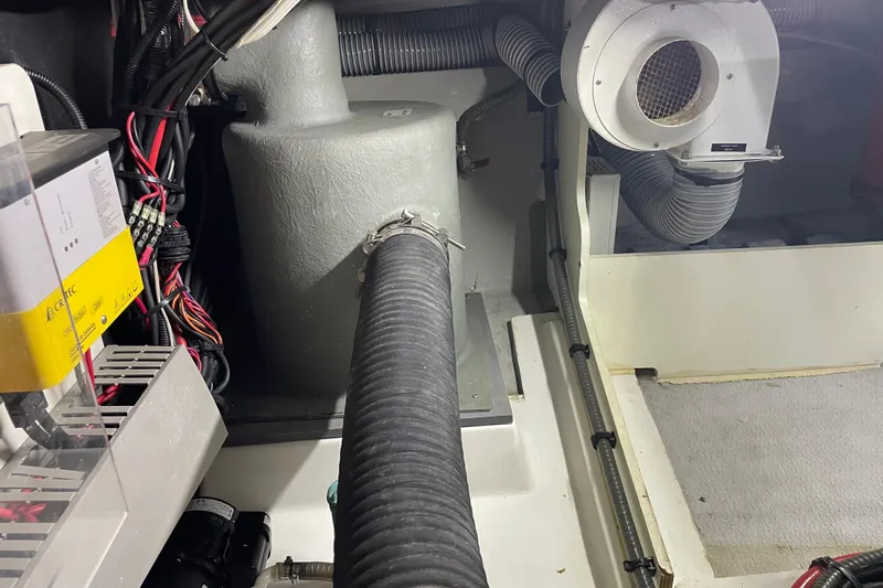 Miss Adventure Yacht Photos Pics Engine room of 2013 Beneteau Swift Trawler 44 with wiring and ventilation system.