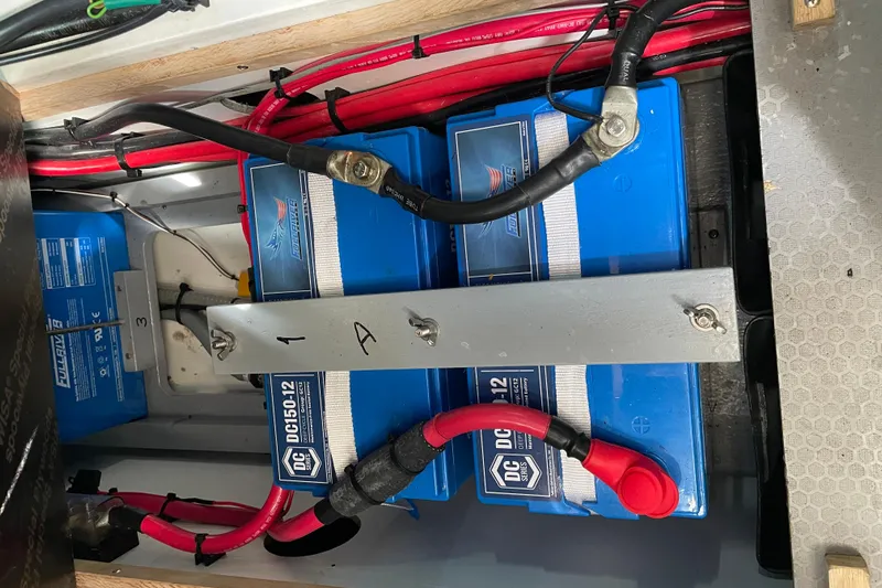Miss Adventure Yacht Photos Pics Battery compartment of a 2013 Beneteau Swift Trawler 44 with wiring connections.