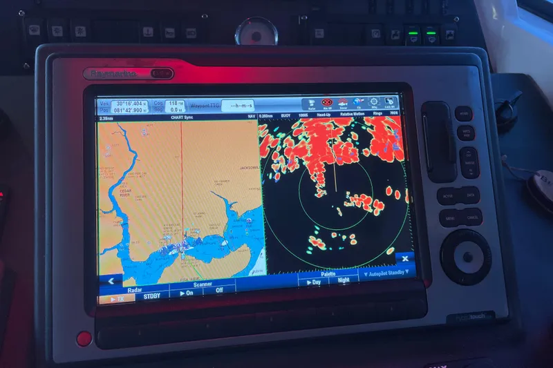 Miss Adventure Yacht Photos Pics Navigation system on 2013 Beneteau Swift Trawler 44 displaying radar and map.