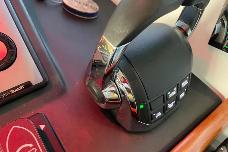 Miss Adventure Yacht Photos Pics Control panel of a 2013 Beneteau Swift Trawler 44 with throttle and navigation controls.