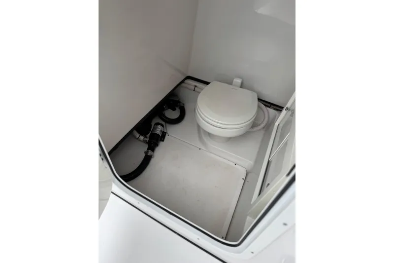  Yacht Photos Pics 2020 Sportsman Open 282TE Center Console boat interior with marine toilet.