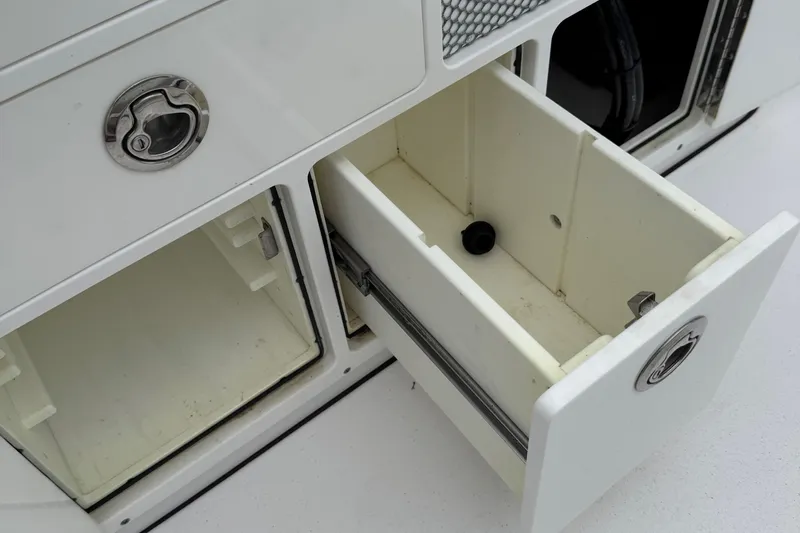  Yacht Photos Pics Open storage compartments on a 2020 Sportsman Open 282TE Center Console boat.
