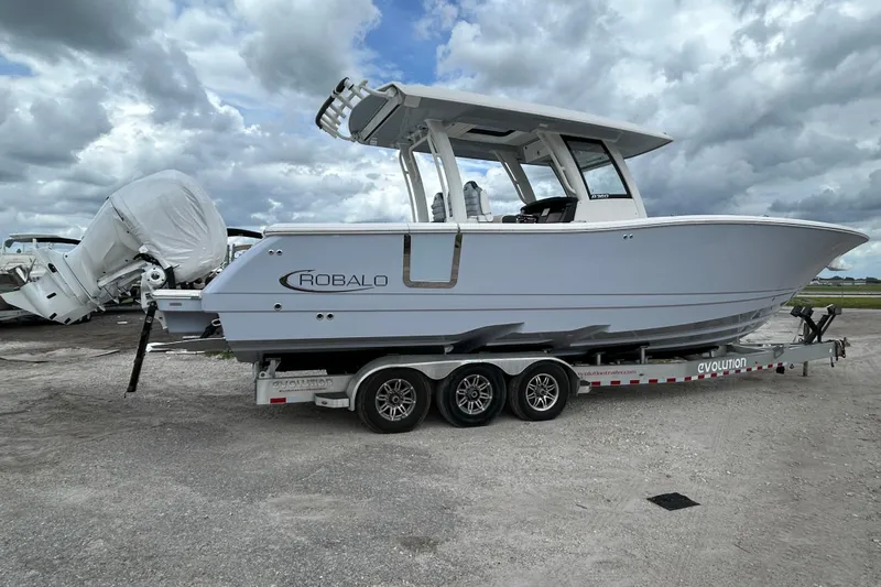  Yacht Photos Pics 2026 Robalo R360 Center Console boat on a trailer under cloudy skies.
