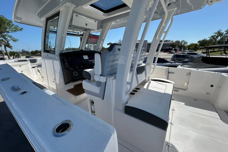  Yacht Photos Pics 2026 Robalo R360 Center Console boat interior with helm and seating area.