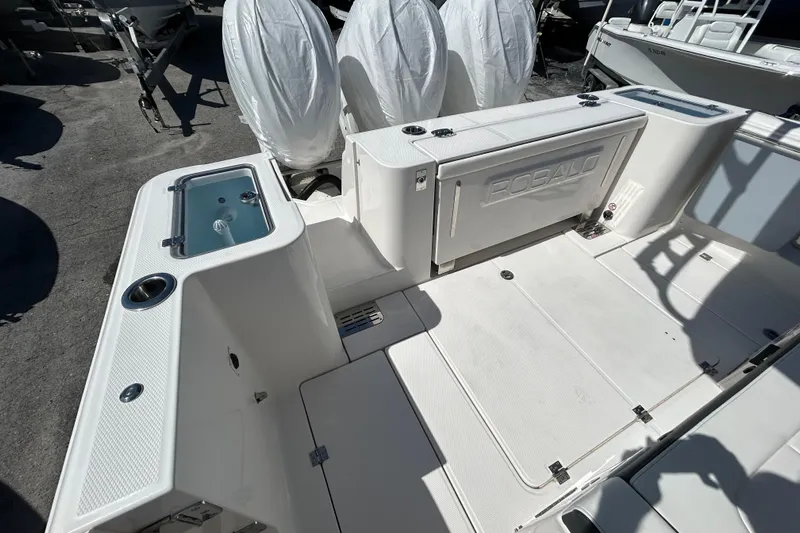  Yacht Photos Pics 2026 Robalo R360 Center Console boat interior with storage and seating areas.